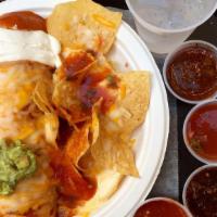 Wet Veggie Burrito · Veggie burrito topped with melted cheese and enchilada sauce.