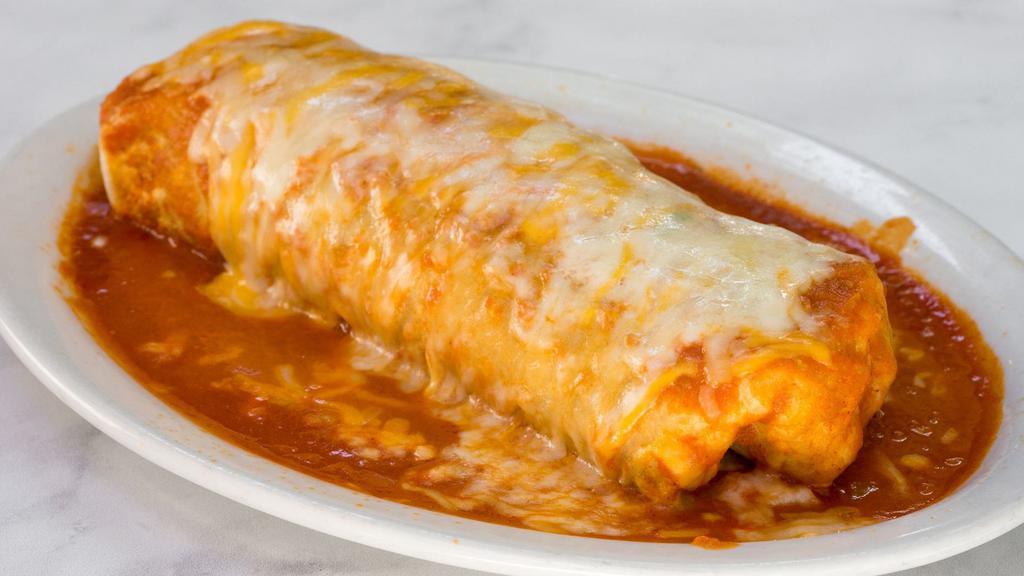 Wet Burrito · Rice, beans, salsa, choice of meat with melted cheese and enchilada sauce.