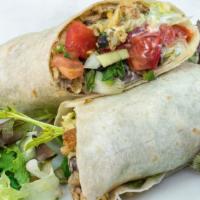 Fish Burrito · Beer-battered crispy fish with guacamole, black beans, lettuce, salsa and sour cream.