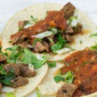 Tacos Rancheros · Three mini carne asada tacos topped with onions, cilantro and salsa fresca.