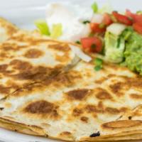 Super Quesadilla · Choice of meat or beans with melted cheese and salsa fresca and a side of sour cream and gua...