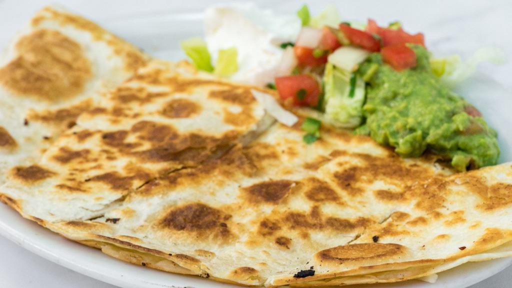 Super Quesadilla · Choice of meat or beans with melted cheese and salsa fresca and a side of sour cream and guacamole.