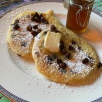 Chocolate Chip Pancakes · 2 large chocolate chip pancakes with syrup and butter.