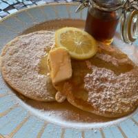 Lemon Pancakes · 2 large buttermilk lemon pancakes served with butter and syrup.
