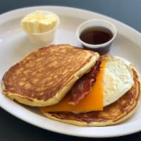 Bacon, Egg ＆ Cheddar Pancake Sandwich · Sandwich built with pork and cheese.