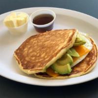 Egg, Avocado ＆ Cheese Pancake Sandwich · Sandwich built with pork and cheese.