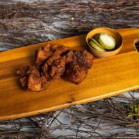 Martian BBQ Wings · The martian bbq are our house specialty. These out of this world wings, smothered in barbequ...