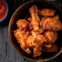 Chicken Wings (Bone-In) · Bone-in Wings tossed in your choice of sauce.