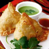 02. Veggie Samosa (2 Pieces) · Vegan. Crispy triangle turnovers with potatoes, peas, and spices filling.