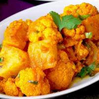 35. Aloo Gobi (vegan) · Vegan. Cauliflower, potatoes, herbs, and spices, sea salt, tomato, and caramelized onion sau...