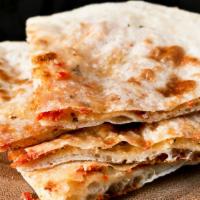 62. Goat Cheese Naan · Naan stuffed with goat cheese and fresh herbs.