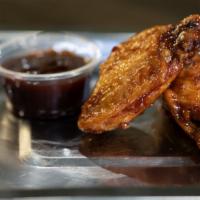 BBQ · Beautifully crispy yet moist chicken wings, 10 pieces per flavor. The name of the flavor is ...
