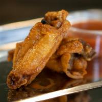 Original Hot · Beautifully crispy yet moist chicken wings, 10 pieces per flavor. The name of the flavor is ...
