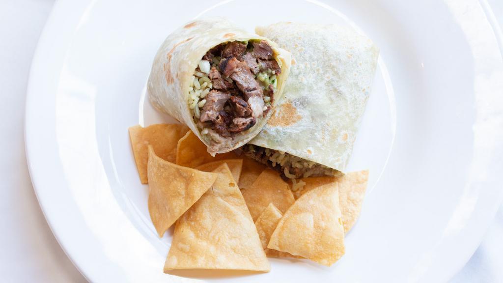 Carne Asada Burrito · warm flour tortilla filled with grilled skirt steak, your choice of black or pinto beans, rice, onions, cilantro, guacamole and salsa.