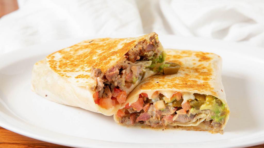 22. Quesadilla El Castillito · A big flour tortilla with melted cheese, any meat, avocado, sour cream, jalapeños, and sauce.