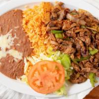 52. Fajitas · Your choice of chicken or beef, scrambled with bell pepper and onions, served with rice, bea...