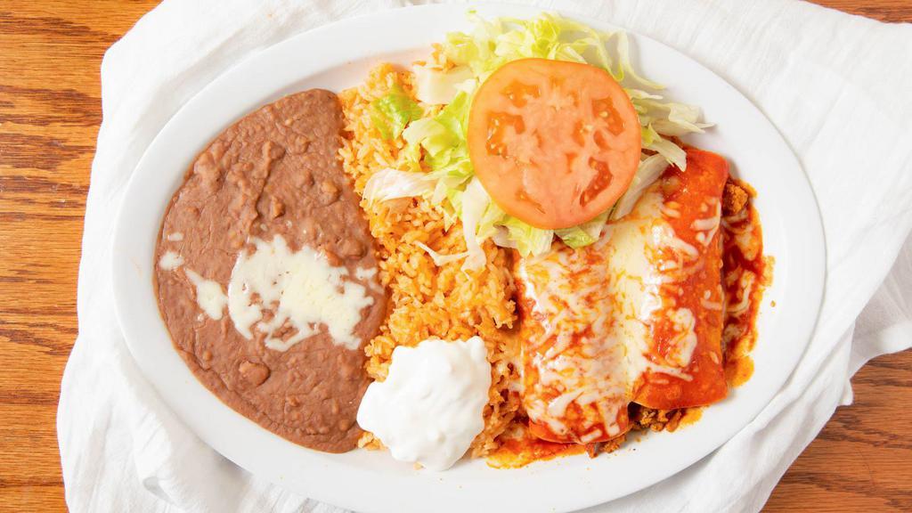Fajitas · Beef or chicken with bell pepper, onions, served with rice, beans, and salad