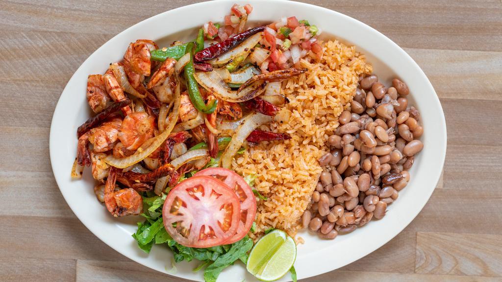 Camarones Al Chile De Arbol · Spicy prawns served with rice, beans  and salad