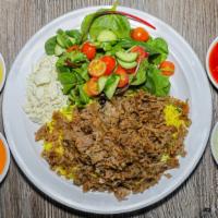 Lamb & Beef Gyro Rice Bowl · Gluten free. House marinated lamb & beef gyro with healthy herbs and spices, rice, house sal...
