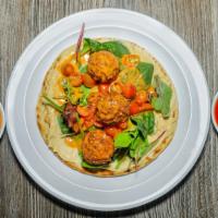 Falafel Wrap · Vegan, vegetarian. Humus, mix spring, tomatoes, tahini sauce.