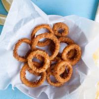 Onion Rings · Whole white onions cut and battered with a subtle blend of spices.