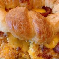 Bacon Croissant Breakfast Sandwich · Fresh Baked Butter Croissant topped with Crispy Boar's Head Bacon, Eggs, and topped with Che...