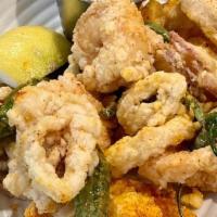 Fried Calamari and Rock Shrimp · calamari and rock shrimp dredged in piment d'ville seasoned flour and fried in rice bran oil...