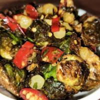 Fried Brussels Sprouts · calabrian chiles, mint, sultanas, capers, lemon, garlic. Gluten Free