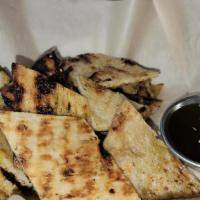 Grilled Flatbread · grilled, house-made dough brushed with extra virgin olive oil, za'atar spice mix (sumac, cit...