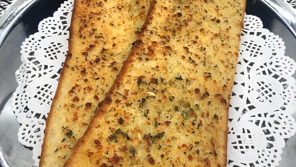 Loaf of Garlic Bread · Baked open-face until toasted and bubbly with our Butter, Garlic and Parmesan Spread