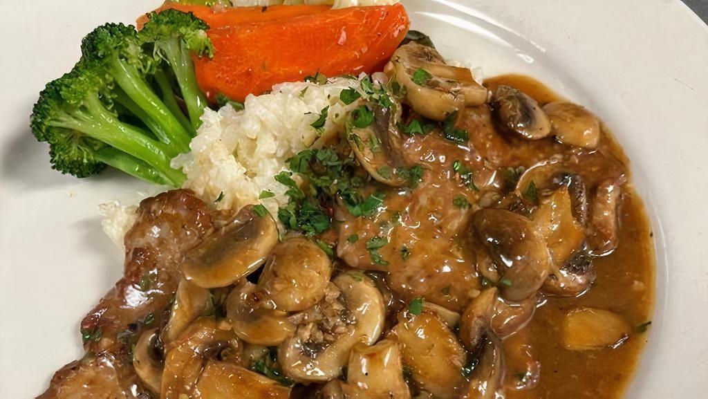 Veal Scaloppini Marsala · Sauteed with Fresh Mushrooms & Marsala wine and served with Risotto and Seasonal Vegetables
