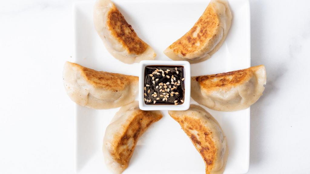 Sweet Potato Potstickers · Pan-seared, gluten-free potstickers filled with roasted sweet potato, fresh garlic, and fresh ginger. Served with our house-made ginger garlic sauce. 5 per order. (Gluten-free & vegan)
