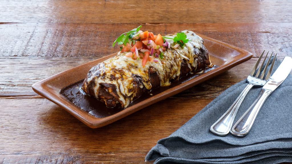Burrito · Choice of protein or mixed vegetables,  rice, beans, cheese, pico de gallo, crema, avocado salsa
