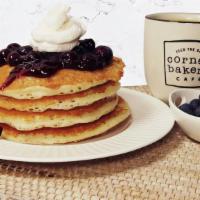 Blueberry Pancakes - New! · For a limited time only! Four fluffy buttermilk pancakes topped with blueberry compote and v...