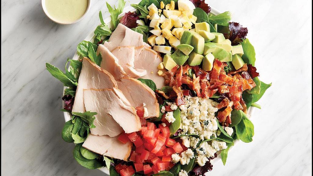 Turkey Avocado Cobb · oven-roasted turkey, bacon, hard-boiled egg, ripe avocado, tomatoes, and crumbled bleu cheese on mixed greens with avocado ranch dressing