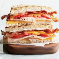Club · oven-roasted turkey, bacon, cheddar, tomato, mayonnaise, grilled sourdough