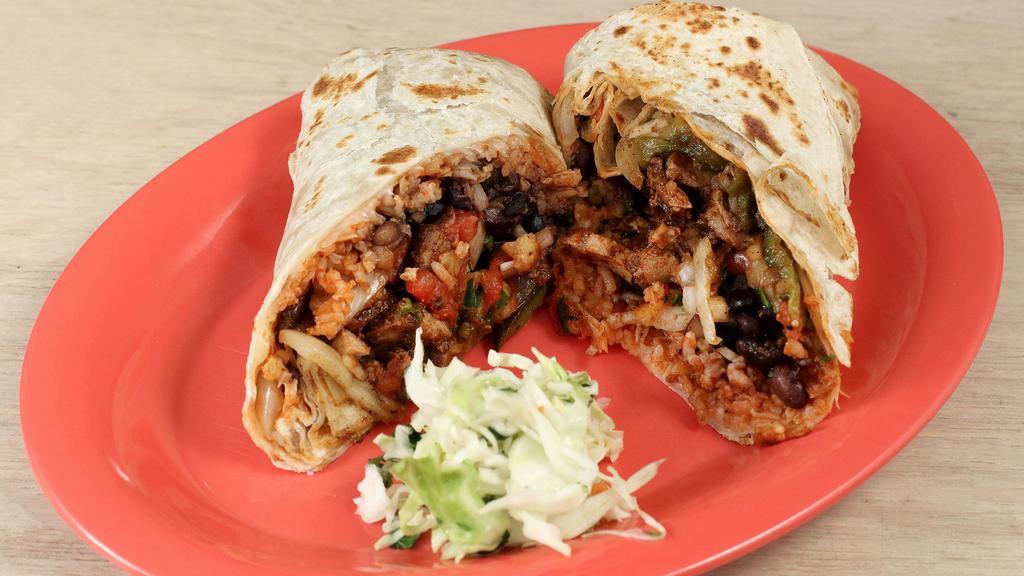 Al Pastor Burrito · Al pastor pork grilled with sautéed onions, poblanos and grilled pineapple salsa on a toasted tortilla with jack cheese, smoky chile salsa, pico de gallo, fresh cilantro and onions, whole black beans and rice.
