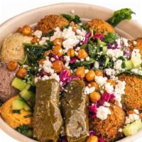Spicy Chickpea Bowl · A bold bowl filled with couscous, Garbanzo Beans, Eggplant Hummus, Tzatziki, Eggplant, Jalap...