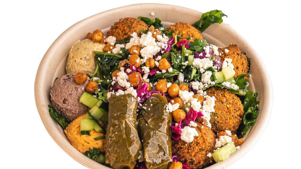 Spicy Chickpea Bowl · A bold bowl filled with couscous, Garbanzo Beans, Eggplant Hummus, Tzatziki, Eggplant, Jalapenos, Dolma, Red Cabbage, Cucumber, Pickled Onion, Garlic Jalapeño Tahini