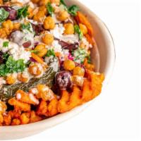 Wild Street Style Fries · Sweet potato fries topped with eggplant, fried jalapeños, chickpea croutons, kale salad, pic...