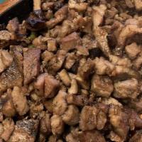 Sizzling Sisig · Diced grilled pork with jalapeno and onions.