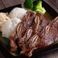 Kalbi Short Rib · Grilled Kalbi Beef Short Ribs served with 2 scoops steamed rice, 1 scoop macaroni salad and ...