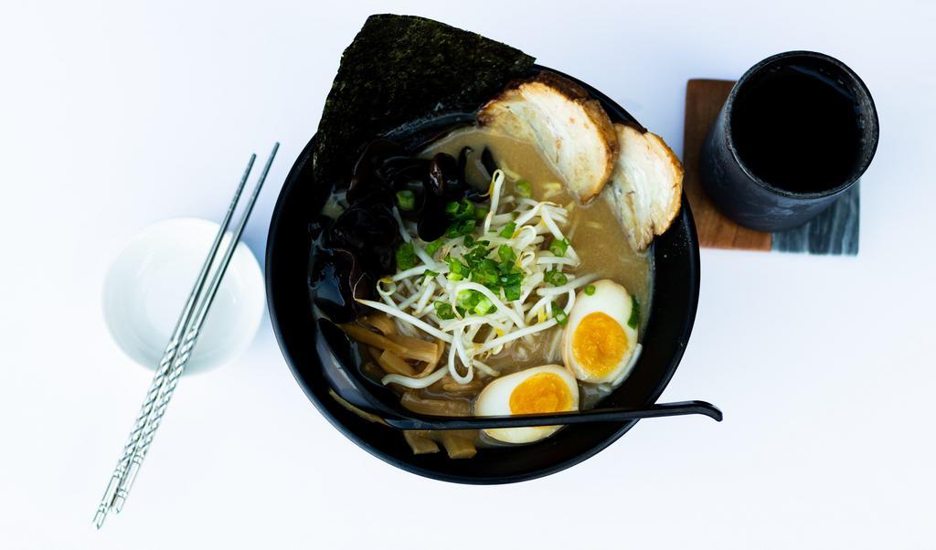 Miso Ramen · Roasted pork, boiled egg, kikurage mushroom, bamboo shoots, green onion, sprouts and fish cake.