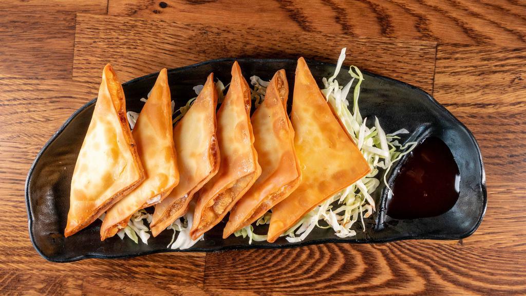 Crab Rangoons (6 Pc) · Deep fried wonton wrappers filled with cream cheese and imitation crab. Comes with a side of sweet and sour sauce.