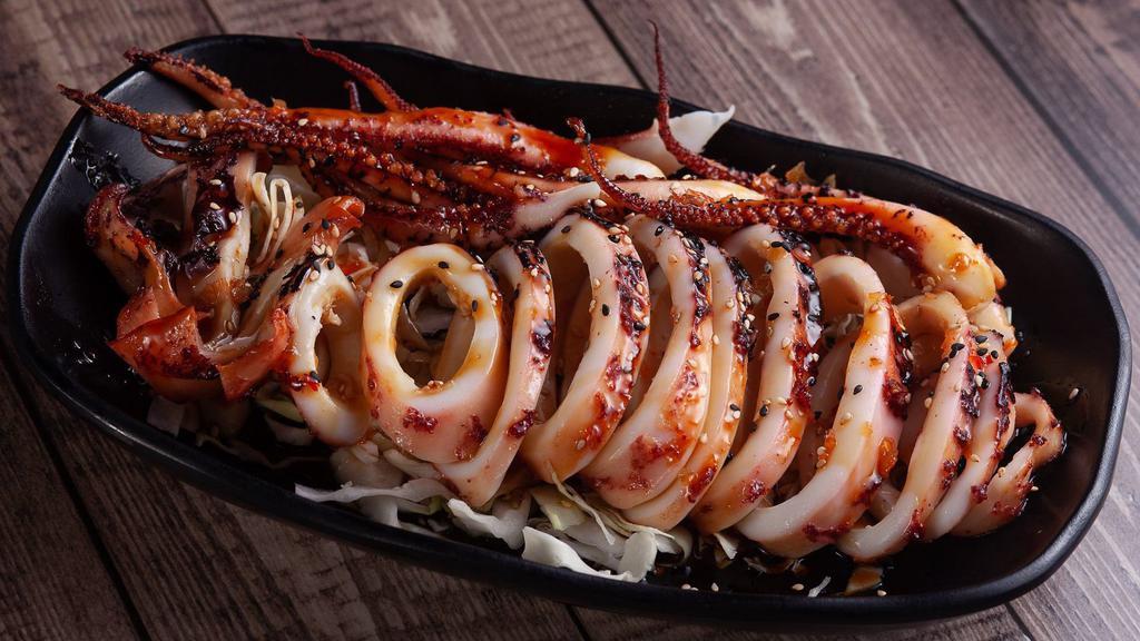 Grill Whole Squid · Grill while squid topped off with sweet Thai chili sauce, teriyaki, and sesame seeds