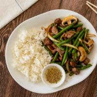 Com Bo Xao Luc Lac · Cubed beef steak stir-fried with green bean, mushroom, and onions served over rice.