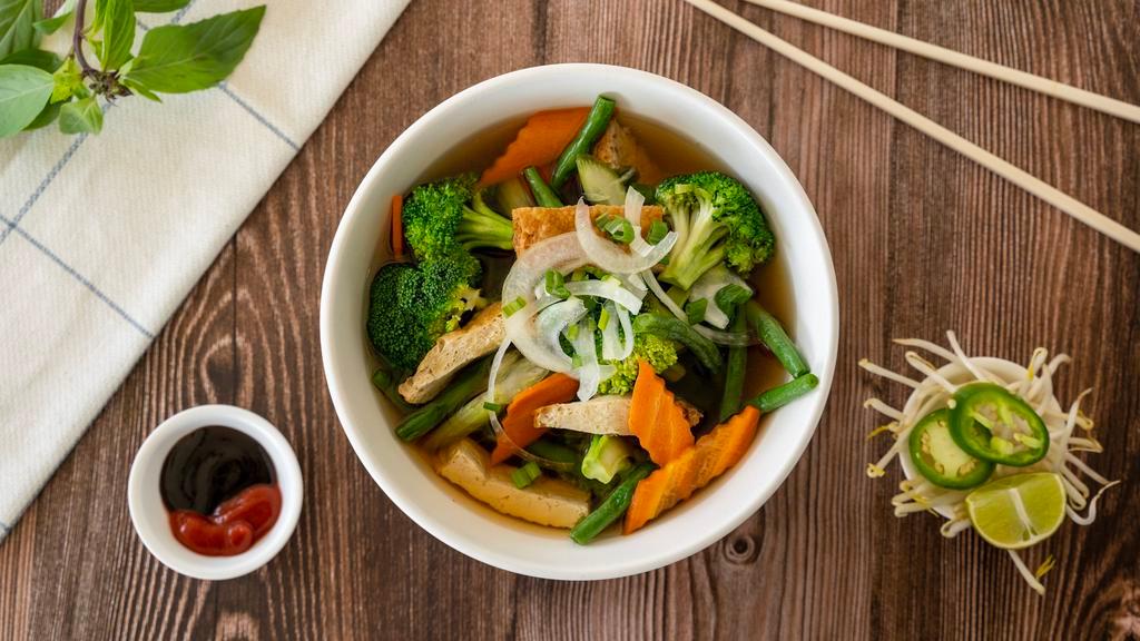 Pho Chay - Vegetables · Pho noodle soup with cooked mixed vegetable and tofu, served with a side of basil and beansprouts.