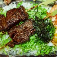 KALBI DON BENTO · 2 skewers of charcoal grilled beef short rib with poached egg, kimchi, green onion, and dry ...