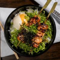 YAKITORI DON BENTO · 2 skewers of charcoal grilled chicken thigh meat with poached egg, lettuce, green onion, and...
