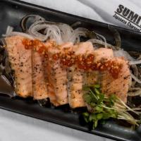 SALMON TATAKI · Seared fresh salmon sashimi with garlic ginger ponzu sauce.